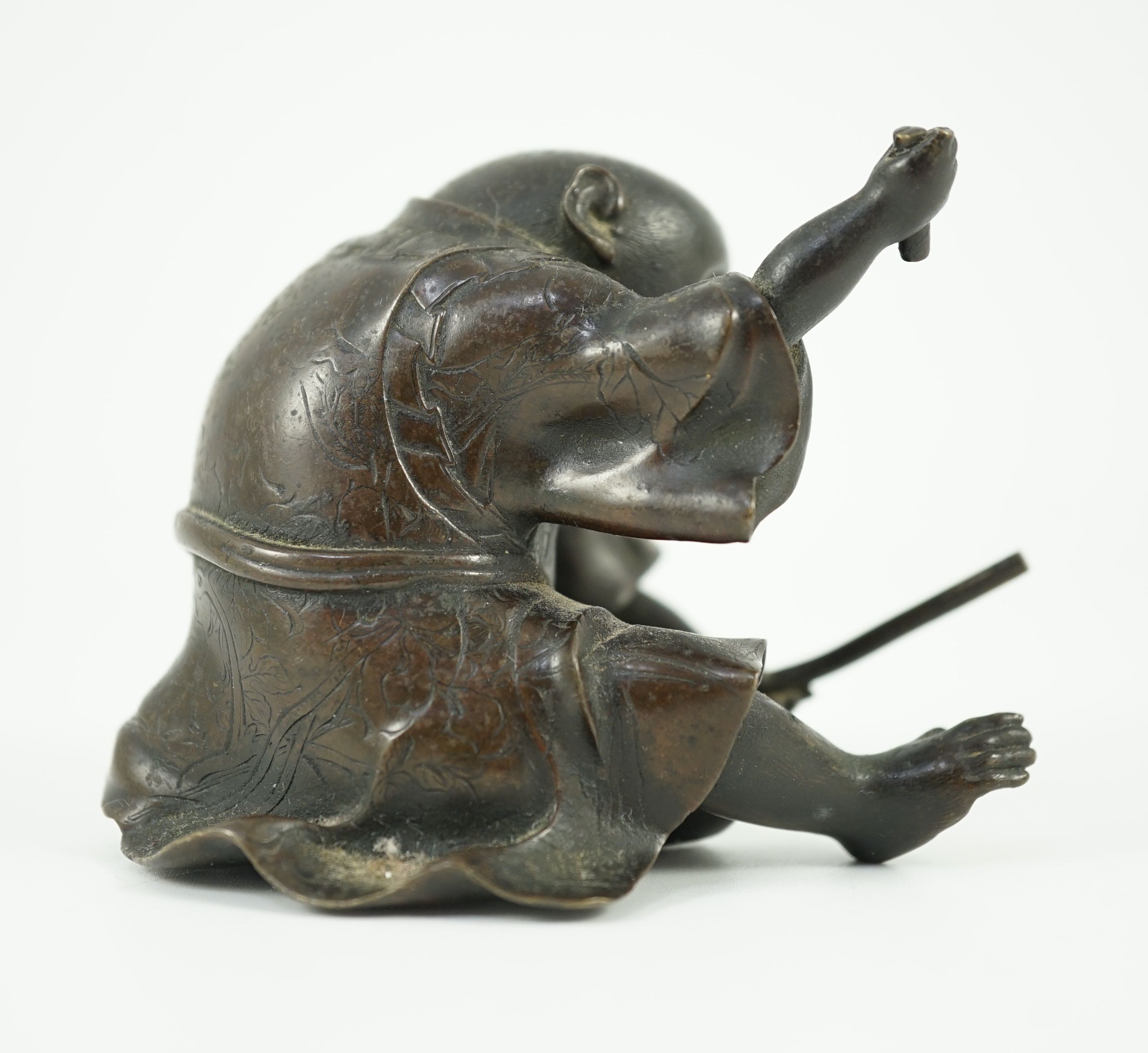 A Japanese bronze figure of a monkey, 19th century, 6cms high.